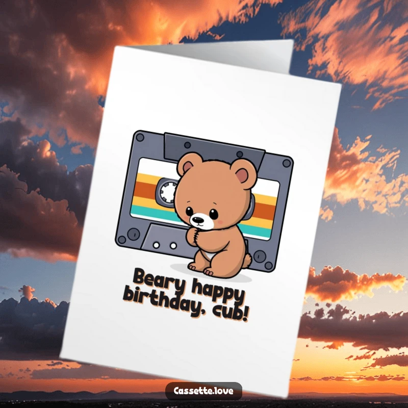 Funny Free Printable Birthday Card: A curious bear cub sniffs the tape ribbon of a giant cassette.